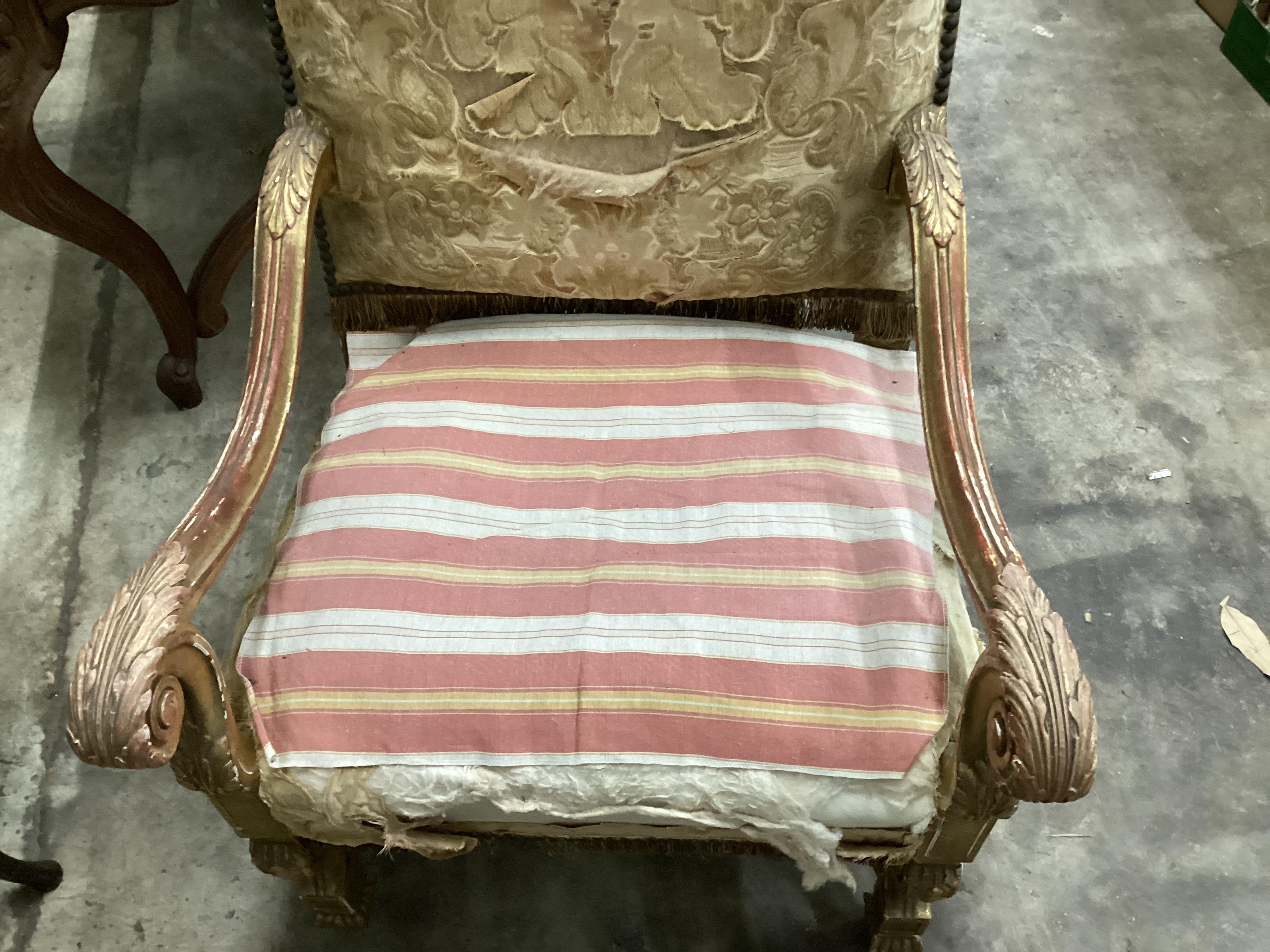 A Louis XIV style carved giltwood armchair, width 66cm, depth 64cm, height 118cm